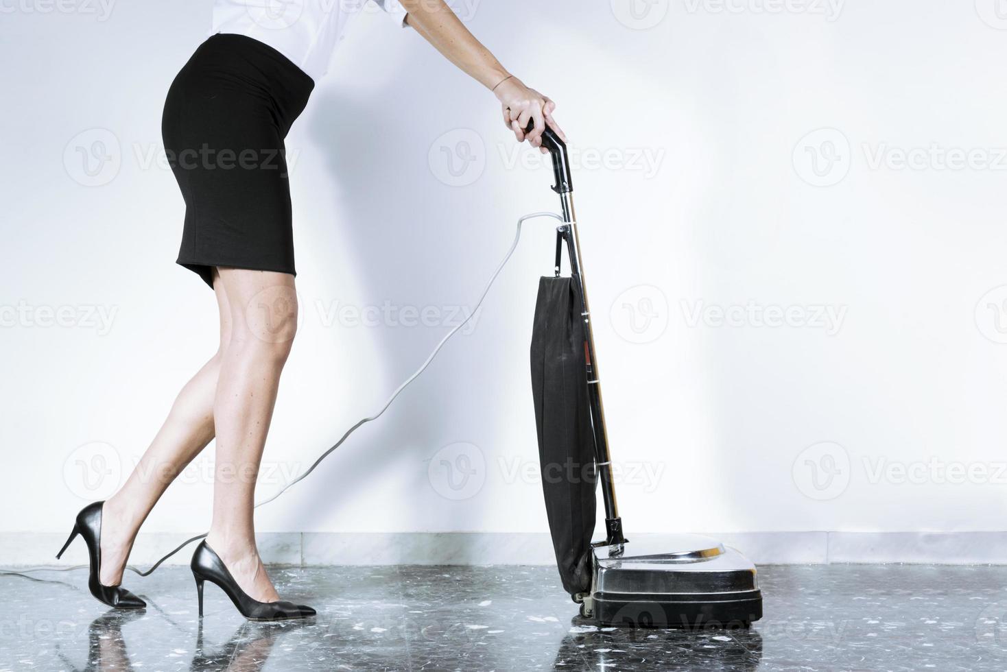 woman in career with vacuum cleaner photo