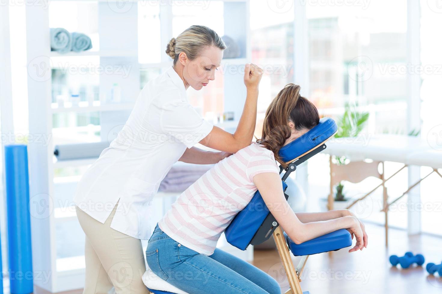 Woman having back massage photo