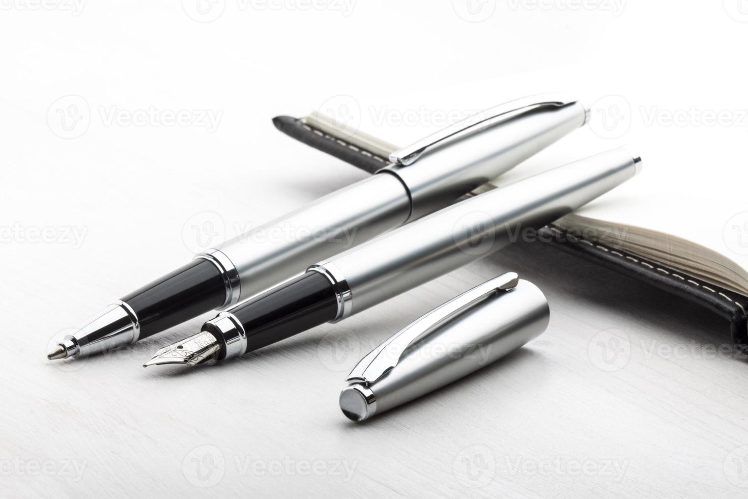 Silver fountain pen and roller pen photo