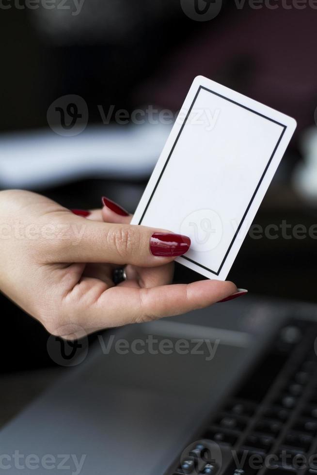 Woman's hand with card photo