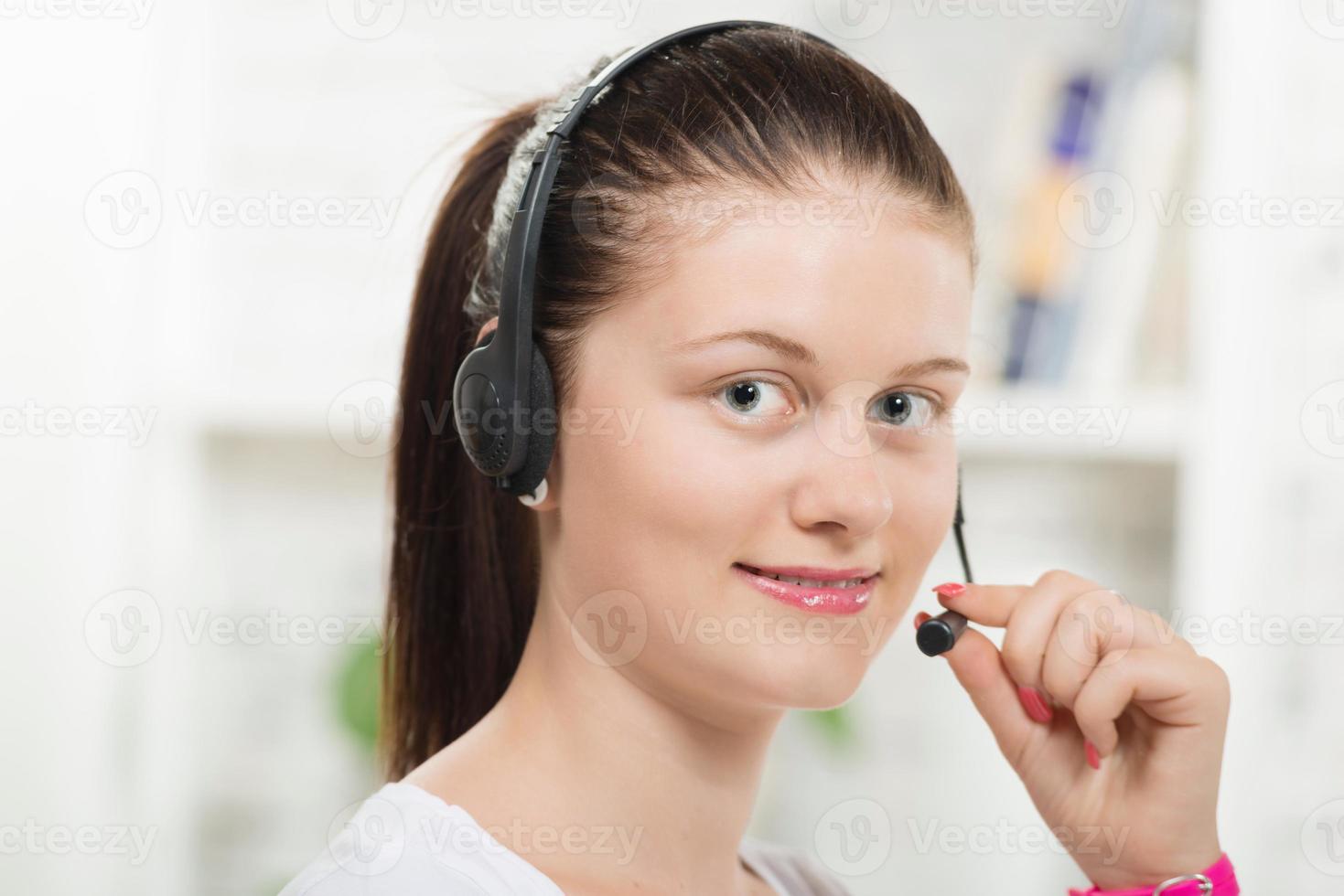 Pretty young woman with a headset photo