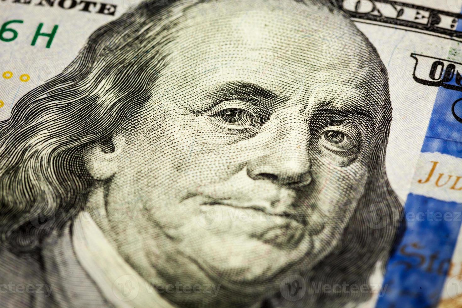 Benjamin Franklin portrait macro shot of 100 bill photo