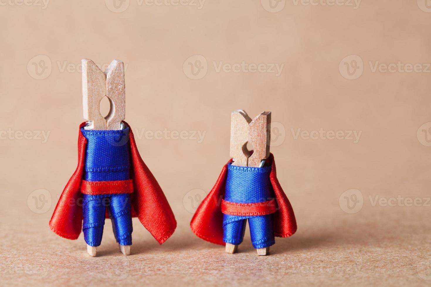 Clothespins. superheroes in blue suit and red cape. photo