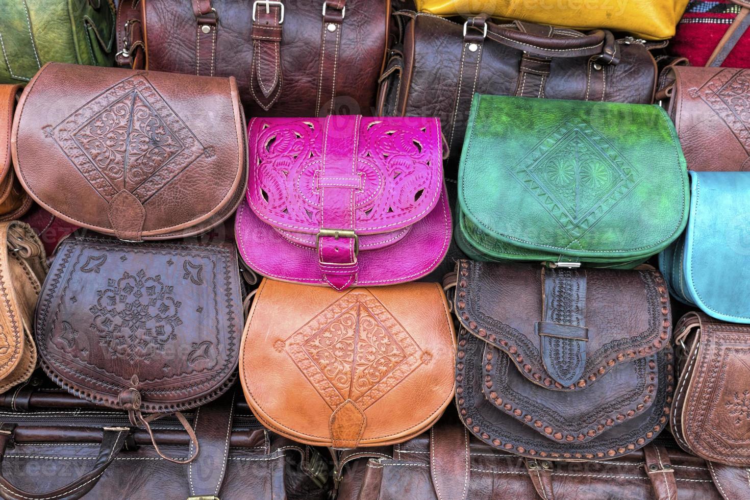 Handmade leather bags on a market in Morocco, Africa photo