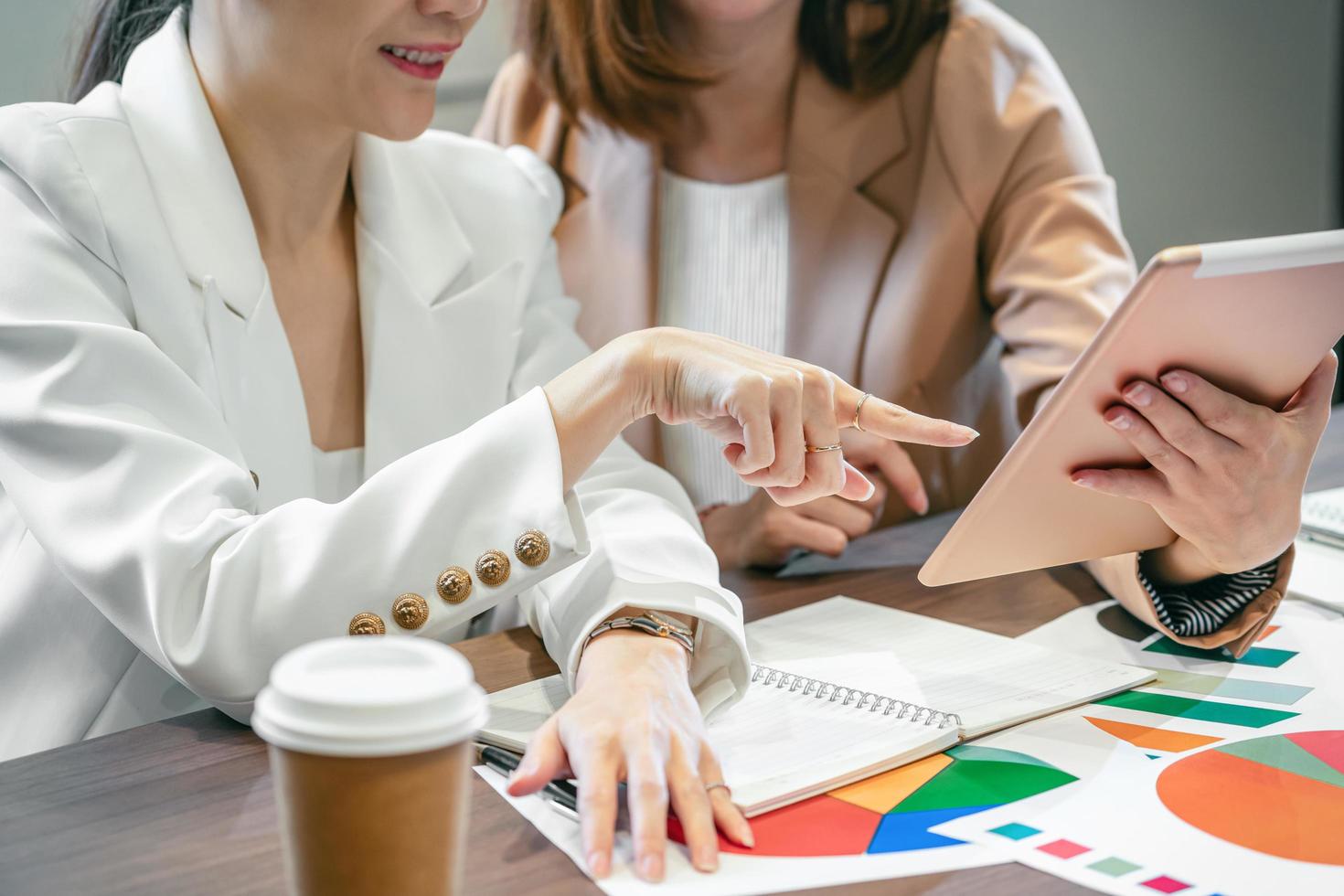 Two Asian professionals working in an office photo