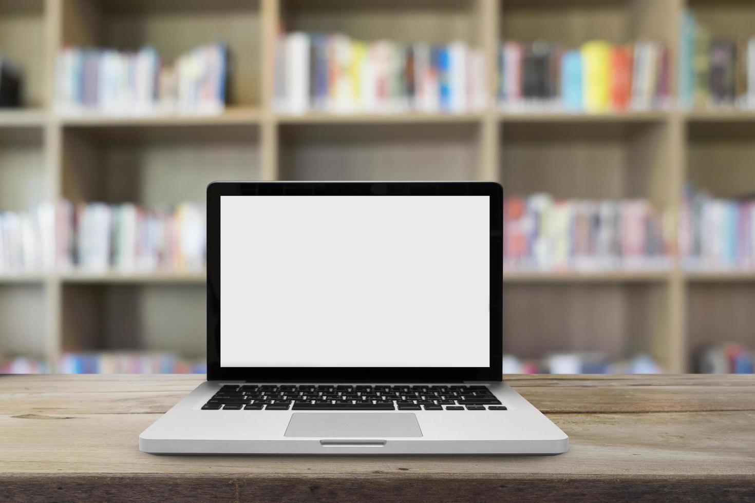 Laptop computer on desk at library photo