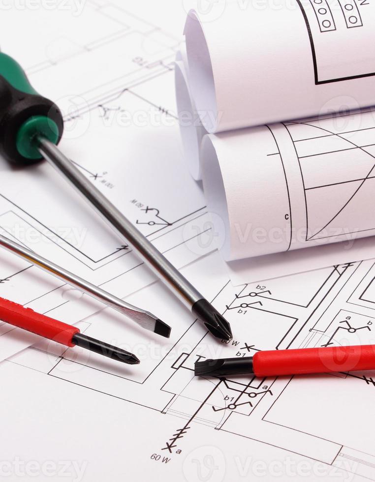 Diagrams and work tools on electrical construction drawing of house photo