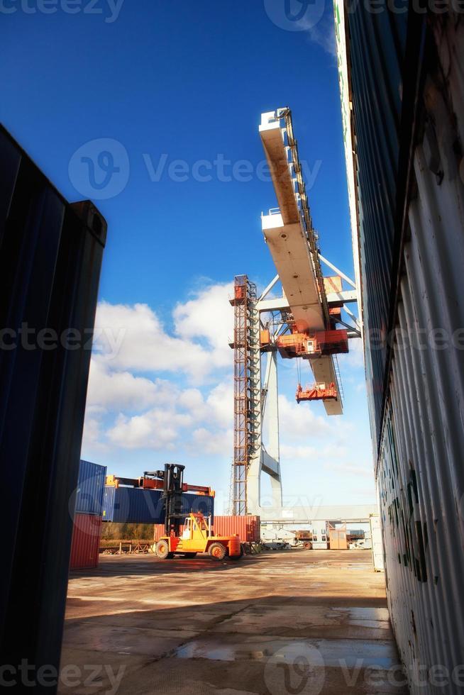 Crane loading containers in the port photo