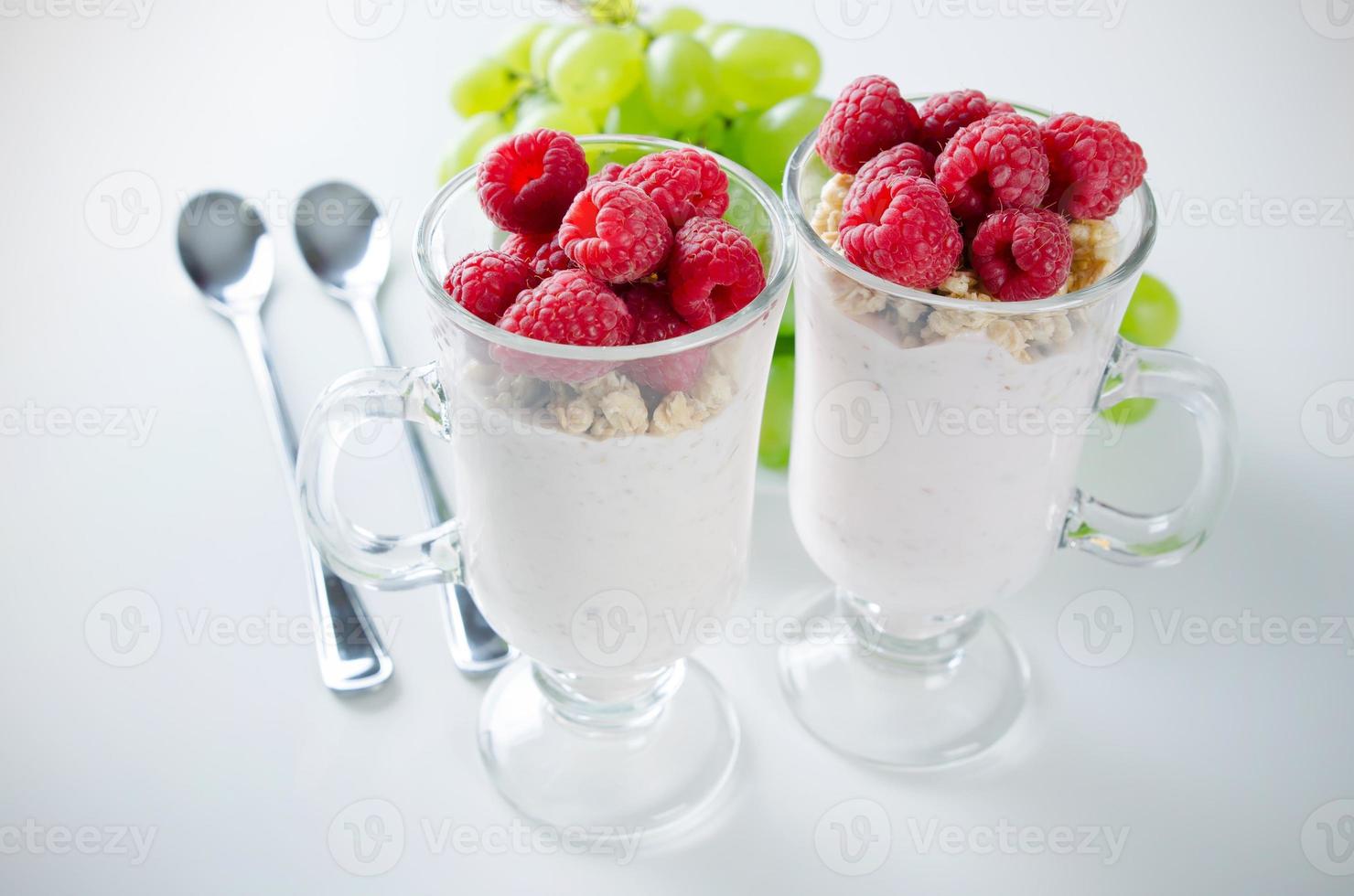 Glass of dessert with yoghurt, fresh berries and muesli photo