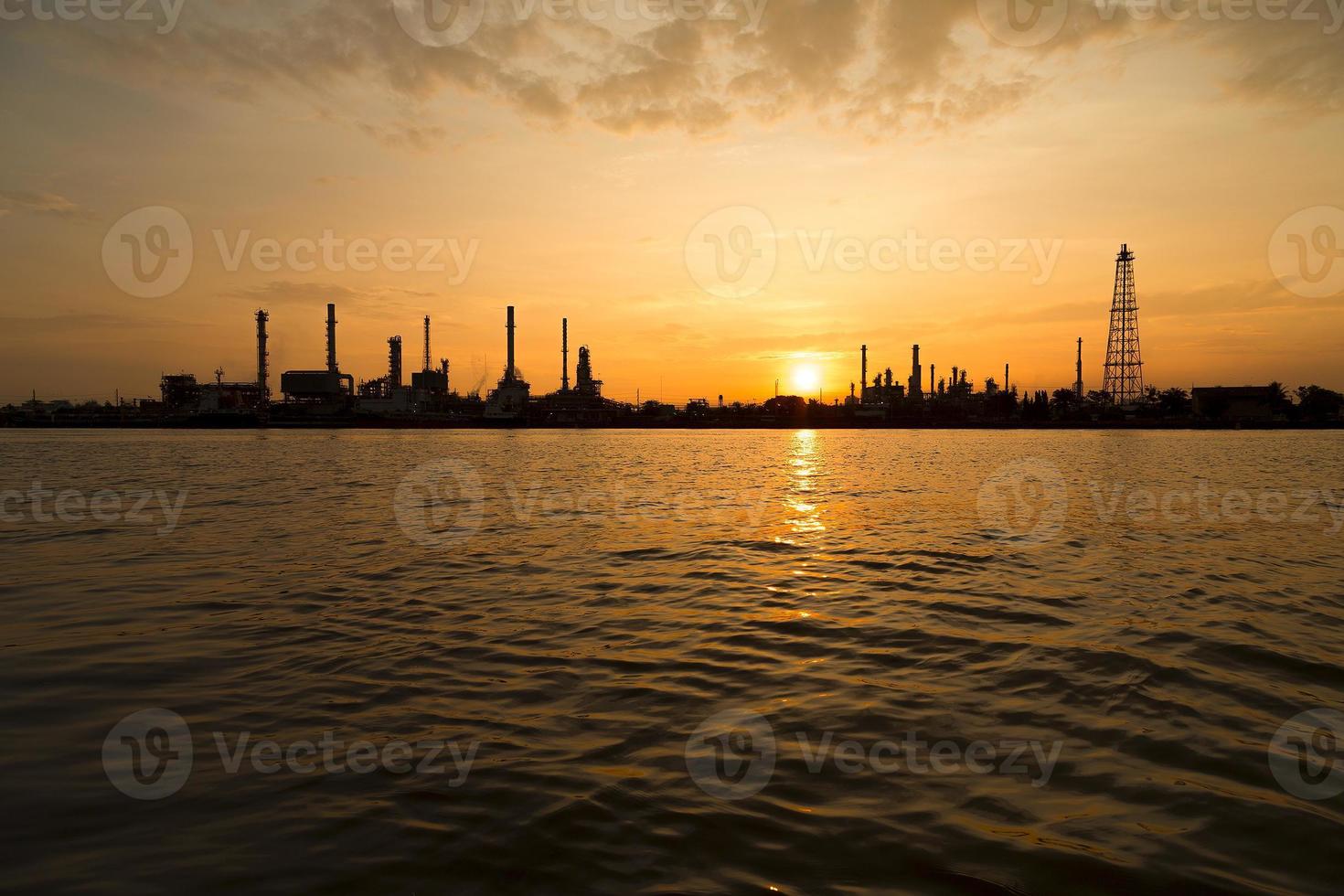 Oil refinery industry plant silhouette in the morning photo