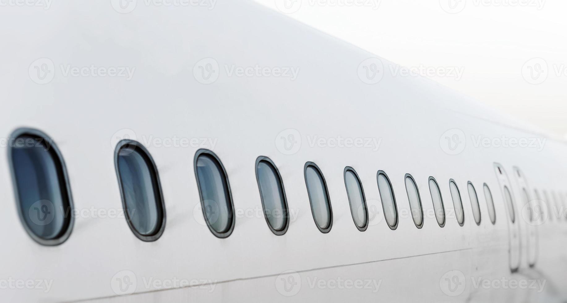 Passenger aircraft windows. View from outside. photo