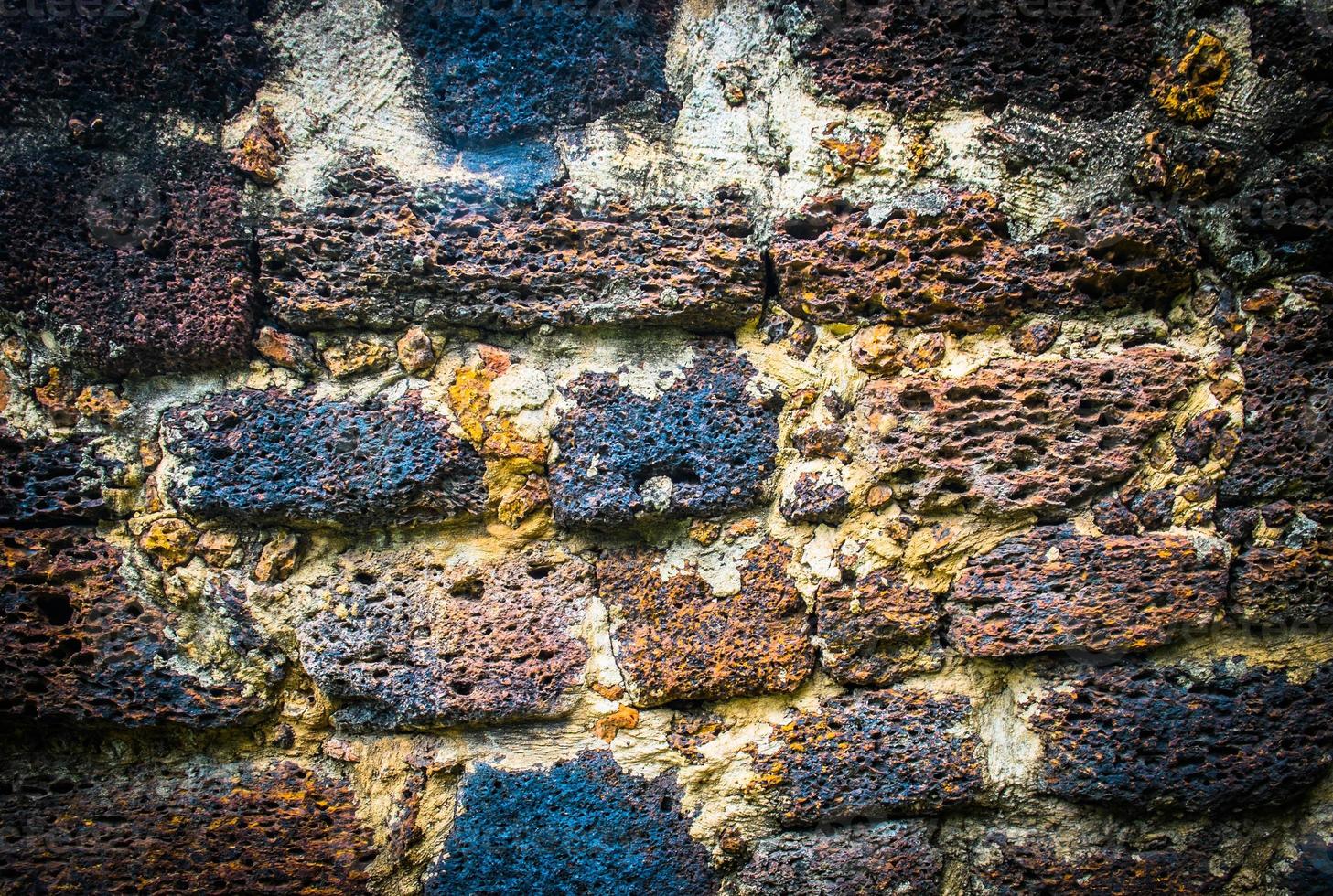 Grunge Texture of Old Laterite stone wall photo