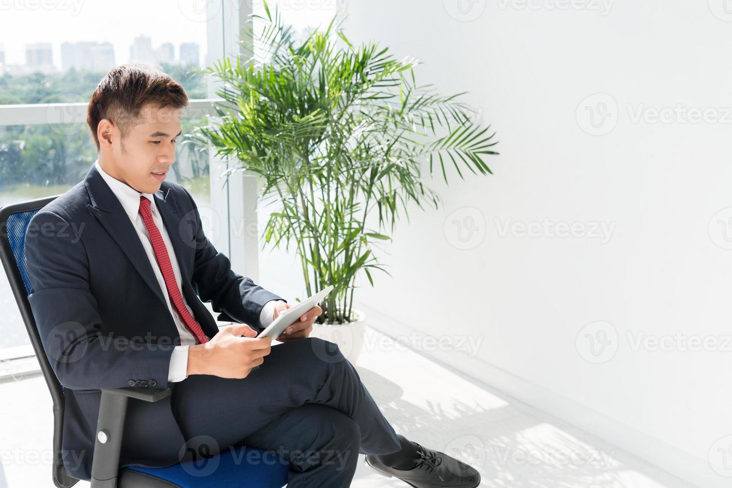 Businessman with digital tablet photo
