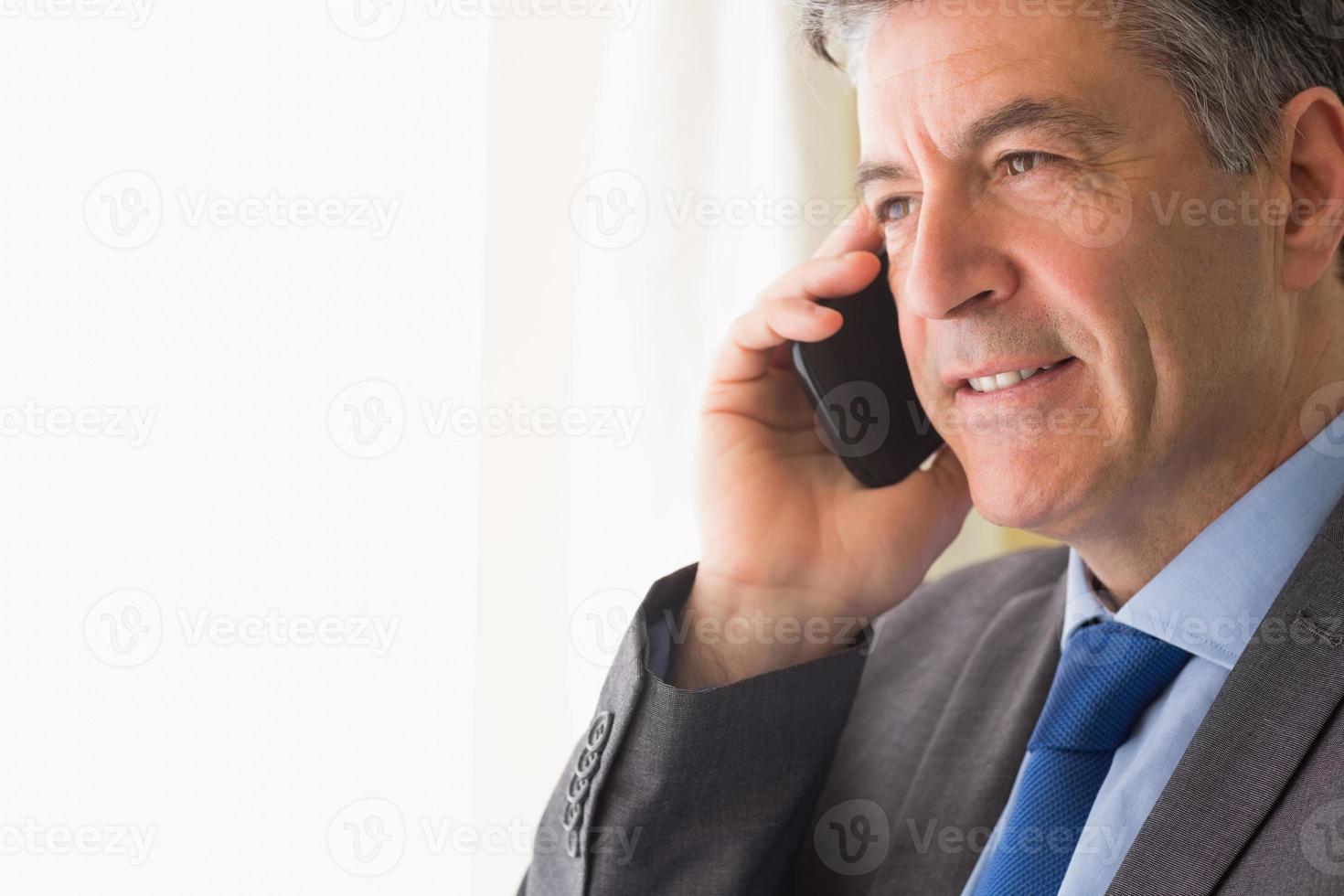 Thoughtful Man Calling Someone With His Mobile Phone 1142743 Stock thoughtful-man-calling-someone-with-his-mobile-phone-1142743-stock