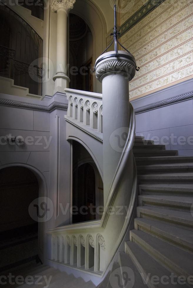 Spiral staircase with column photo