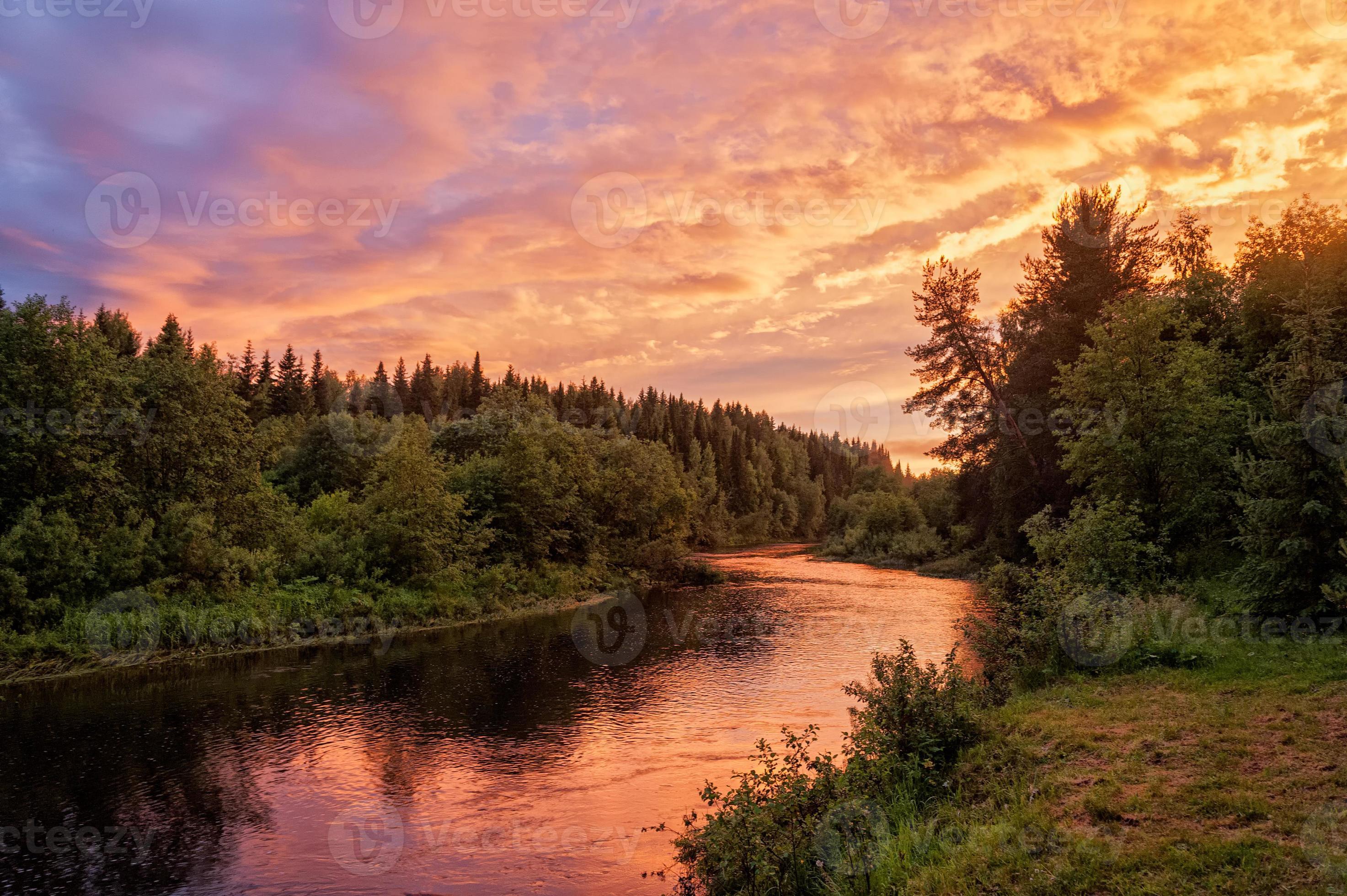 Bright Dramatic Sunset Over River With Forest Along Riverside 1158030