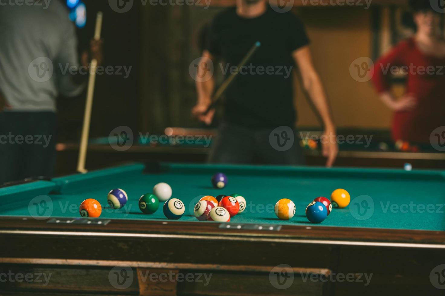 Friends play billiards., Stock image