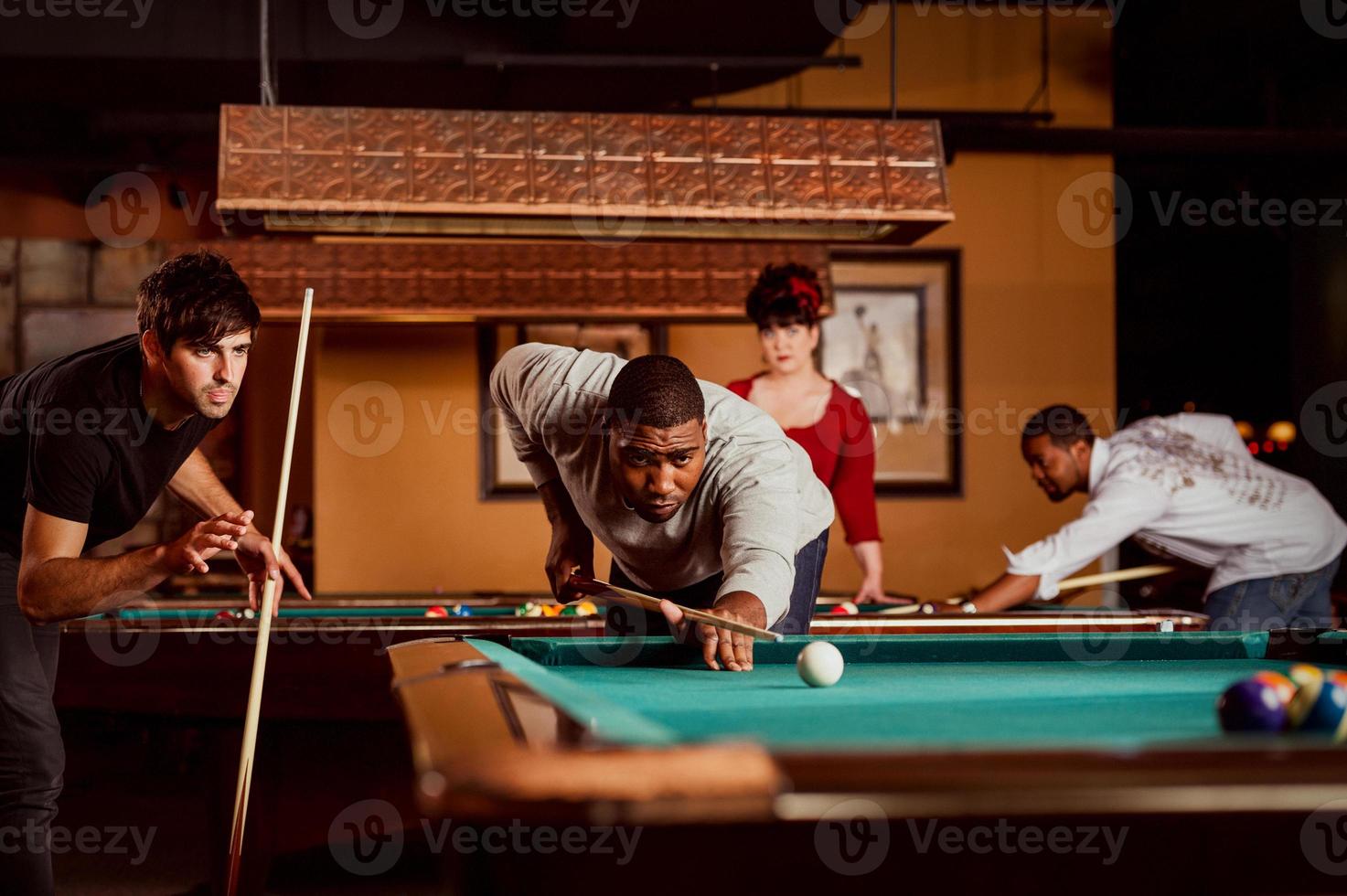 Friends play billiards., Stock image