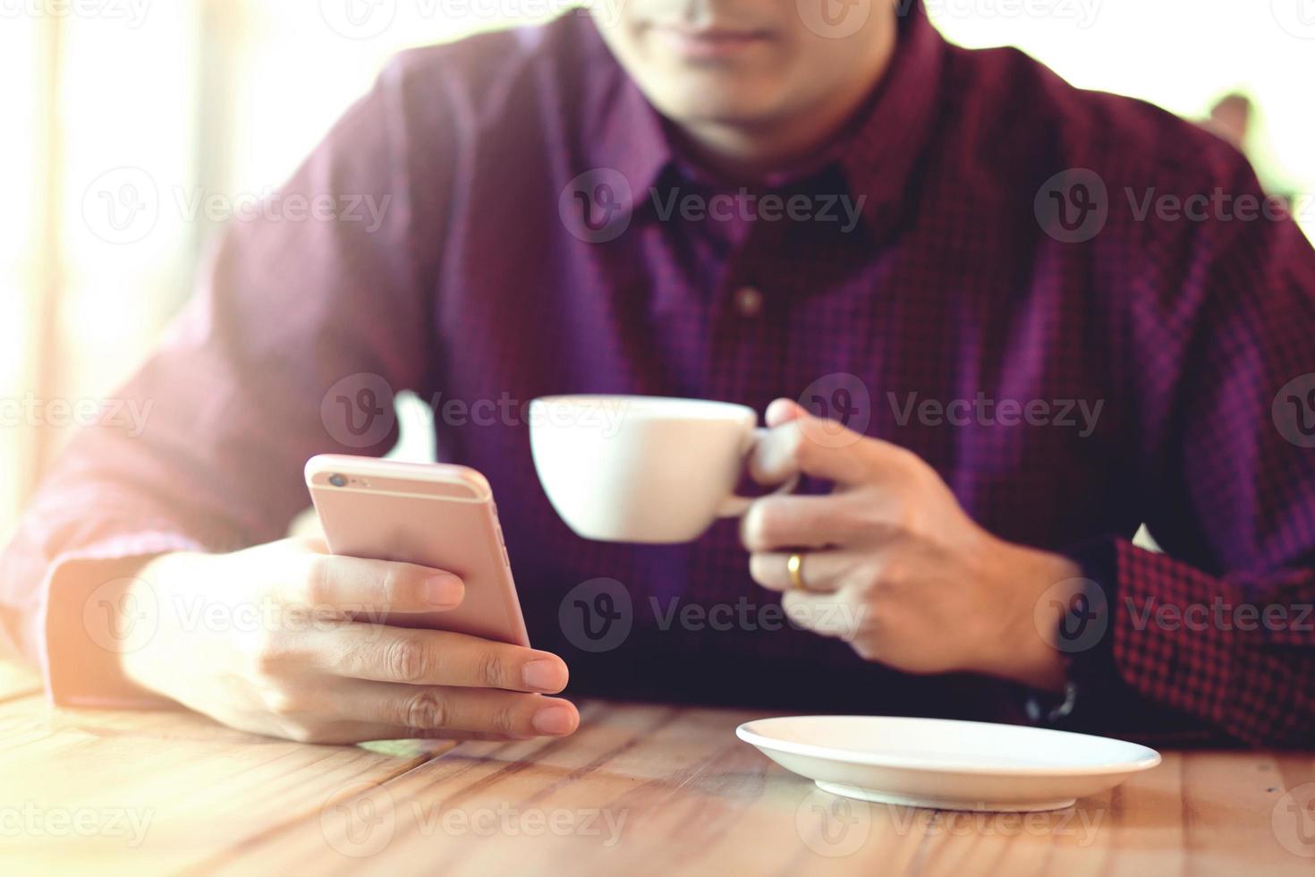 Handsome Business man in an using telephone in coffee shop. photo