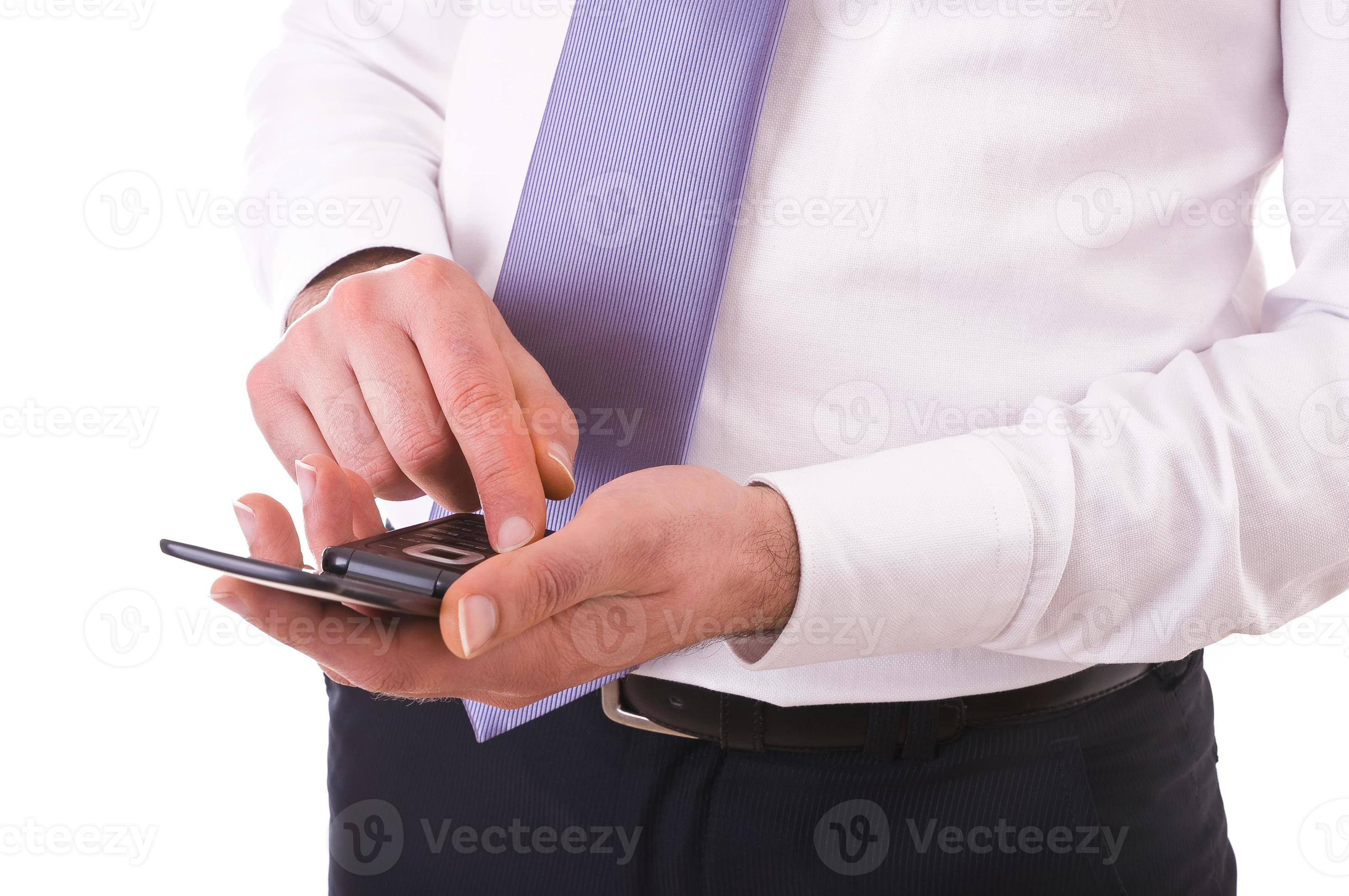 Businessman using cellphone. photo