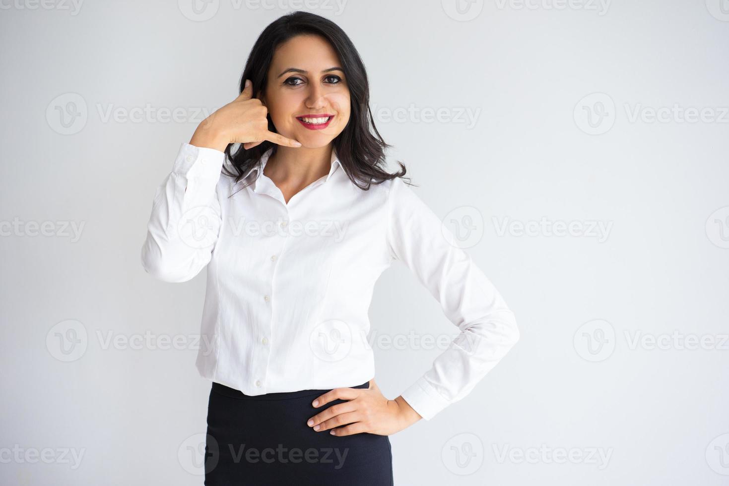 Happy Pretty Business Lady Making Call Me Gesture photo