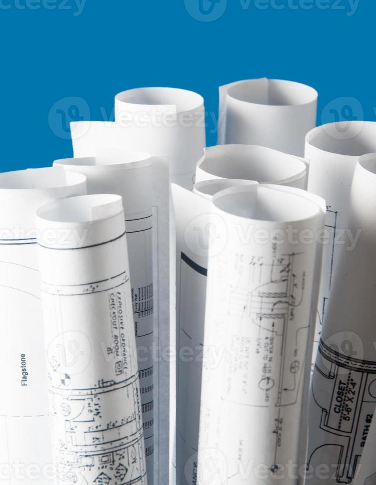 rolls of architecture blueprints and house plans photo