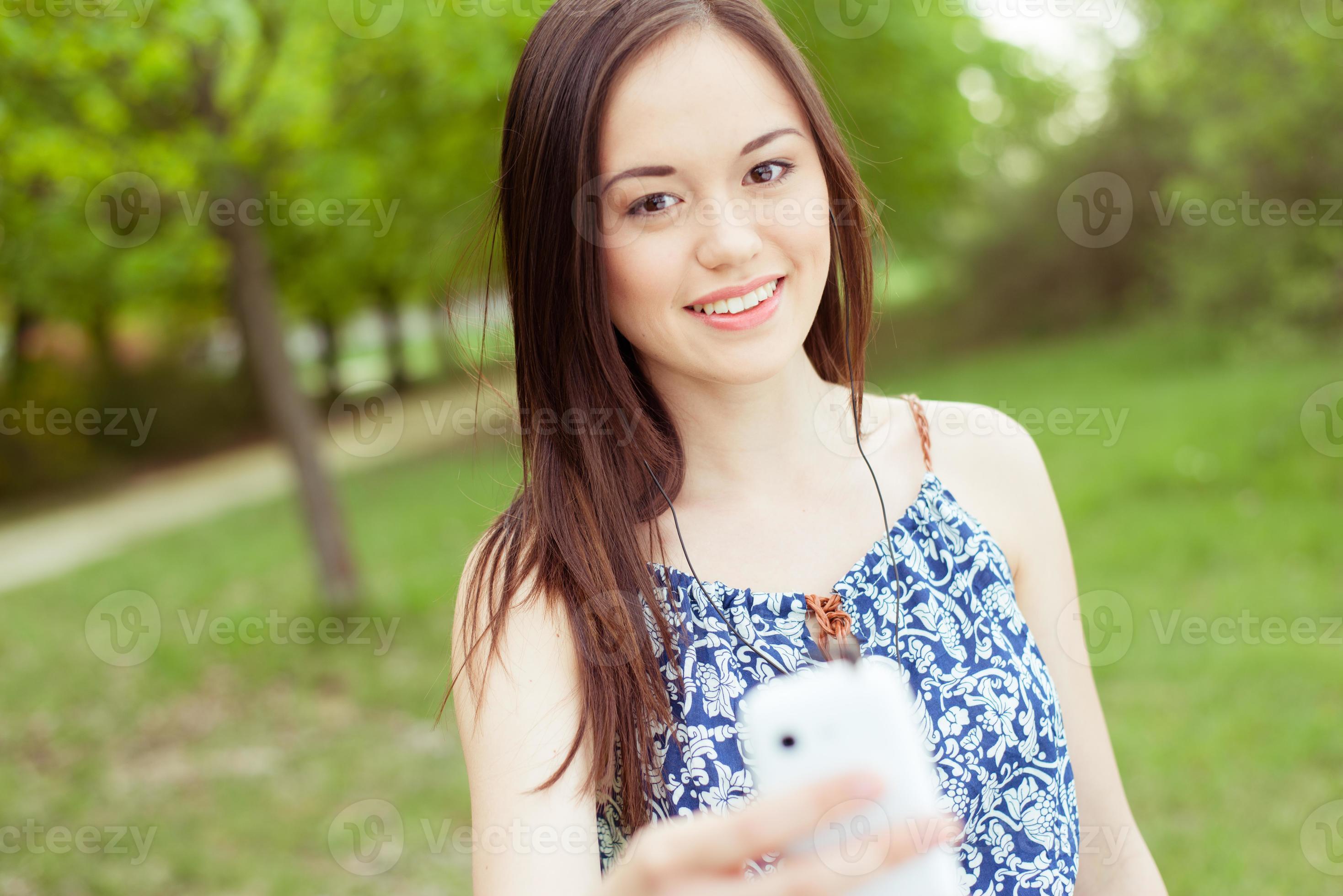Young asian woman using smart phone outdoor photo