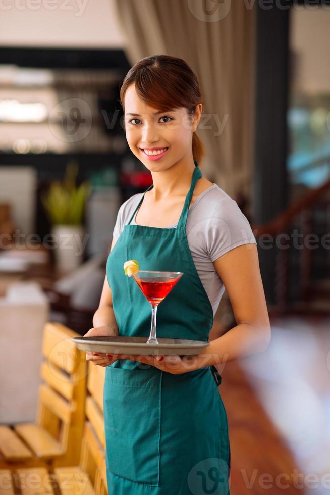 Waitress with a cocktail photo