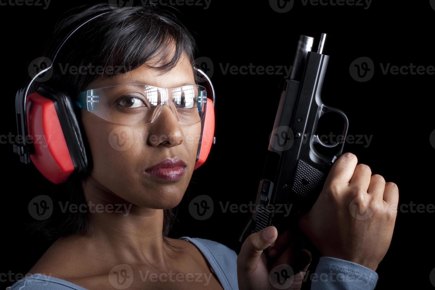 Woman wearing eye and ear protection at a gun range 1184462 Stock Photo