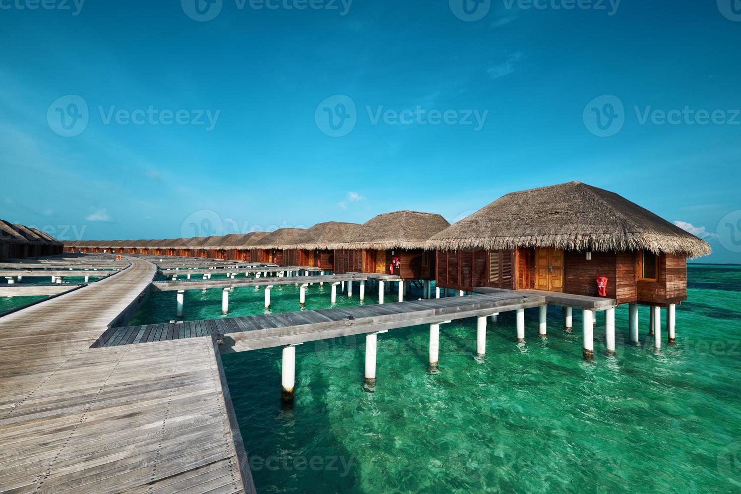Beautiful beach with water bungalows photo