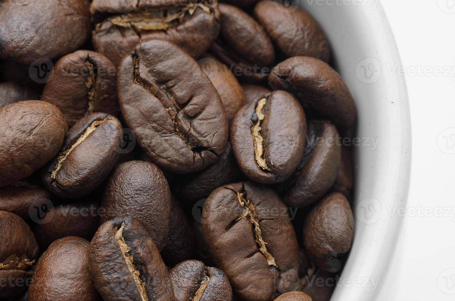 Roast organic coffee beans in white mug photo
