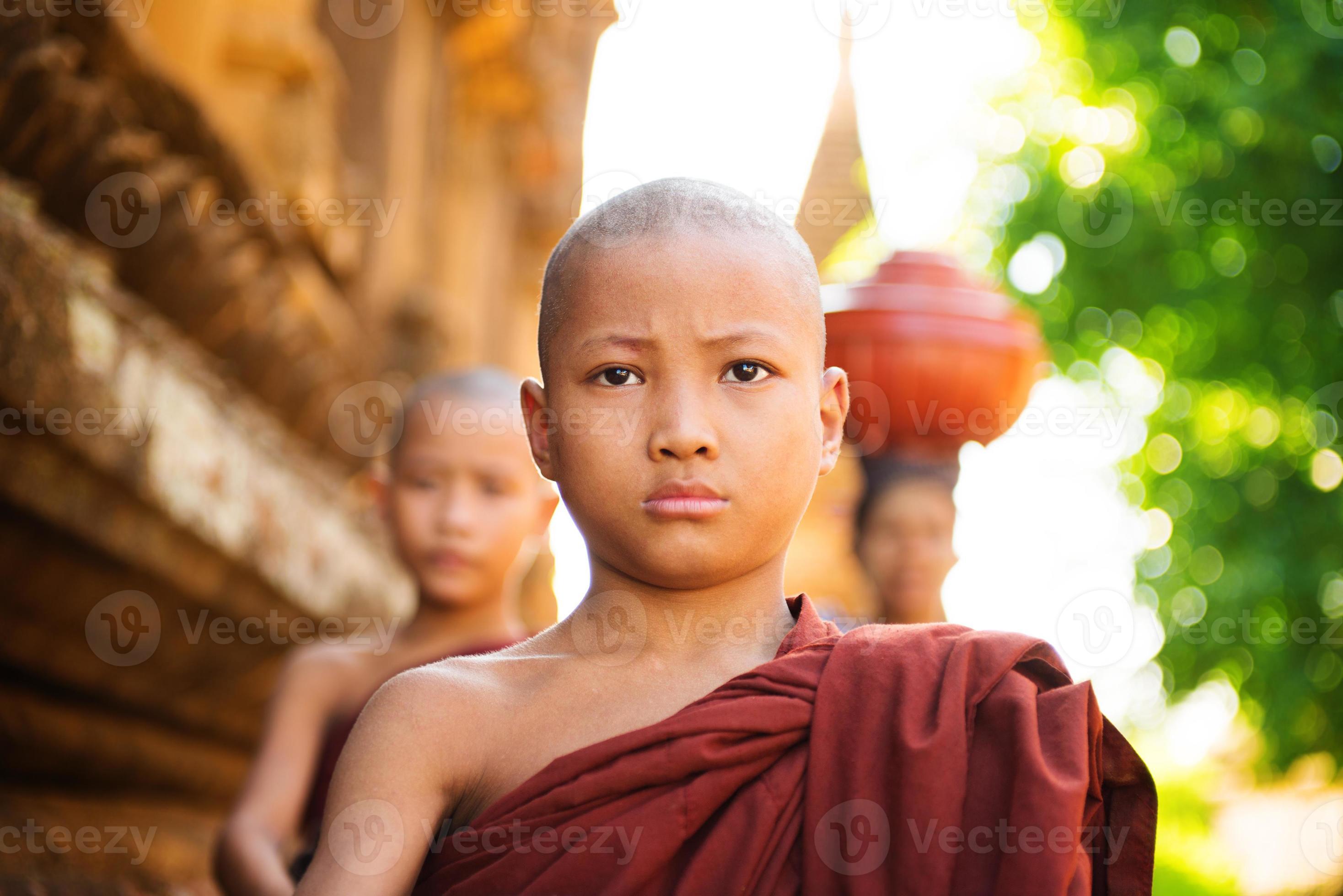 Young Buddhist monks walking morning alms 1185493 Stock Photo at Vecteezy