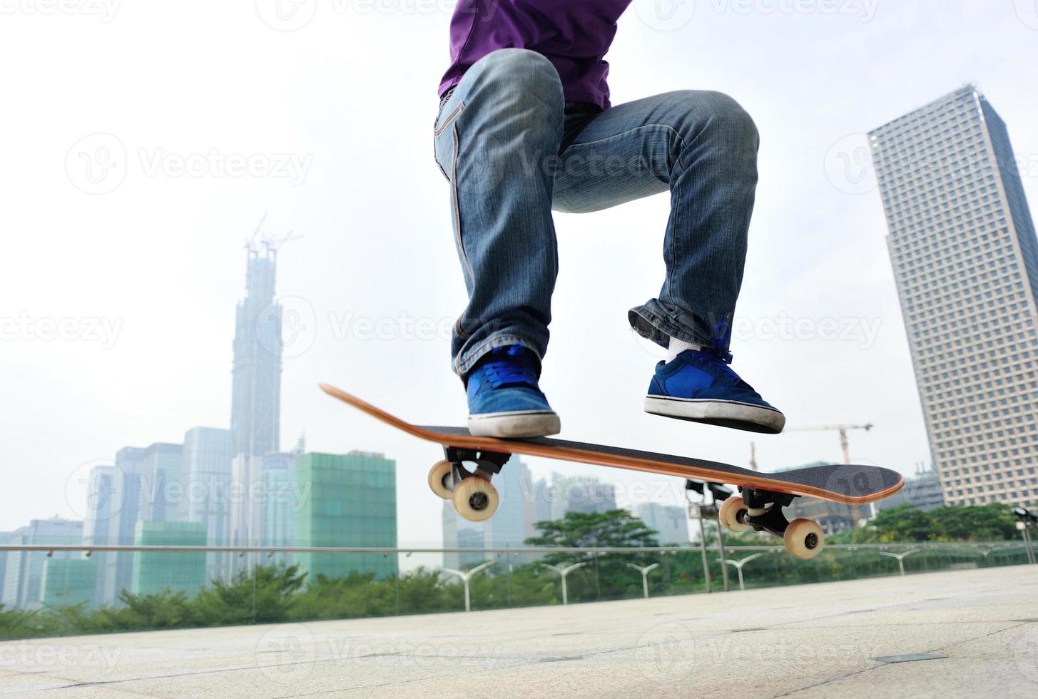 skateboarding woman jumping photo
