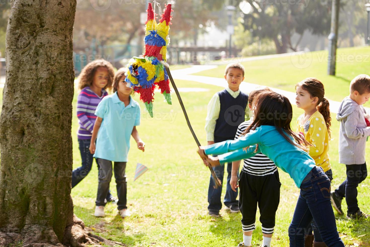 Children Hitting Pinata At Birthday Party 1186565 Stock Photo at Vecteezy