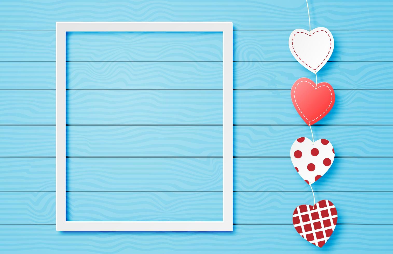 White frame with heart string on blue wood vector