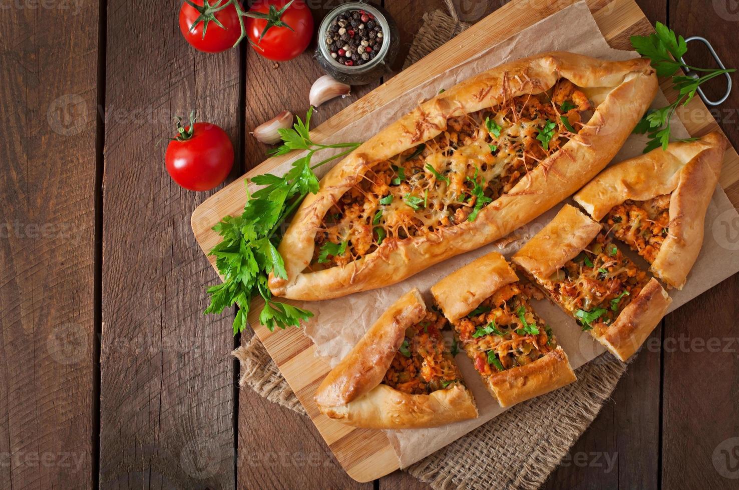 Turkish pide traditional food with beef and vegetables photo
