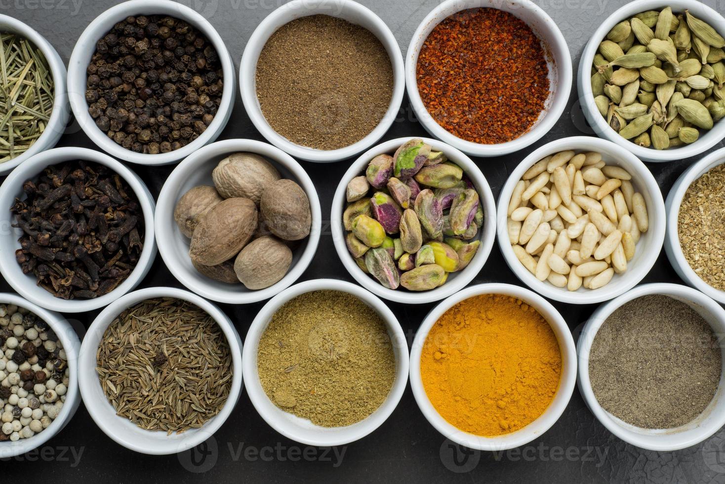 large collection of different spices and herbs isolated photo