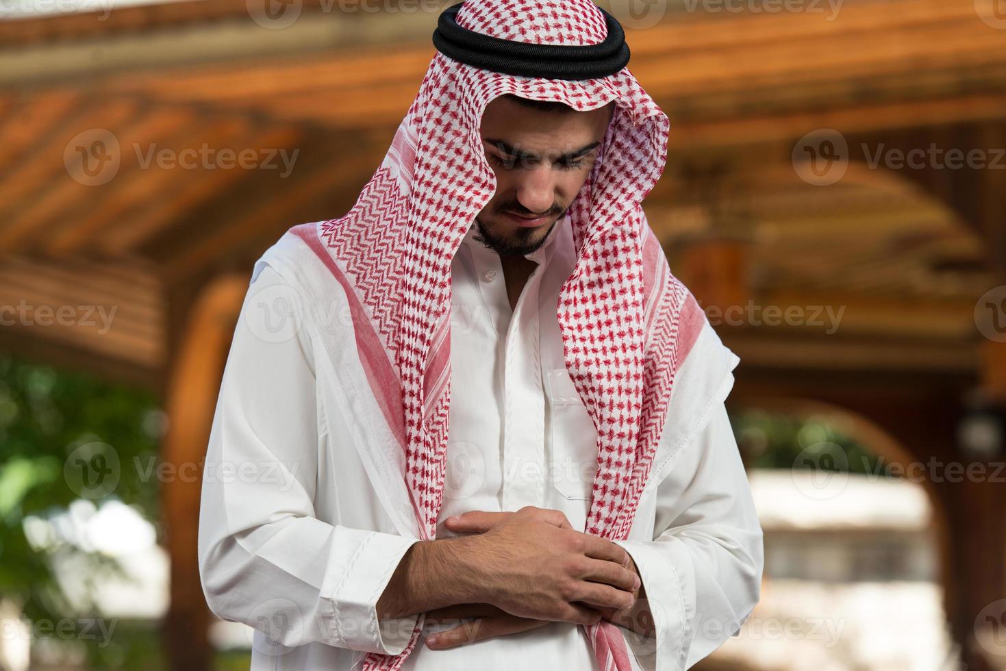 Close-Up Of Male Hands Praying In Mosque photo