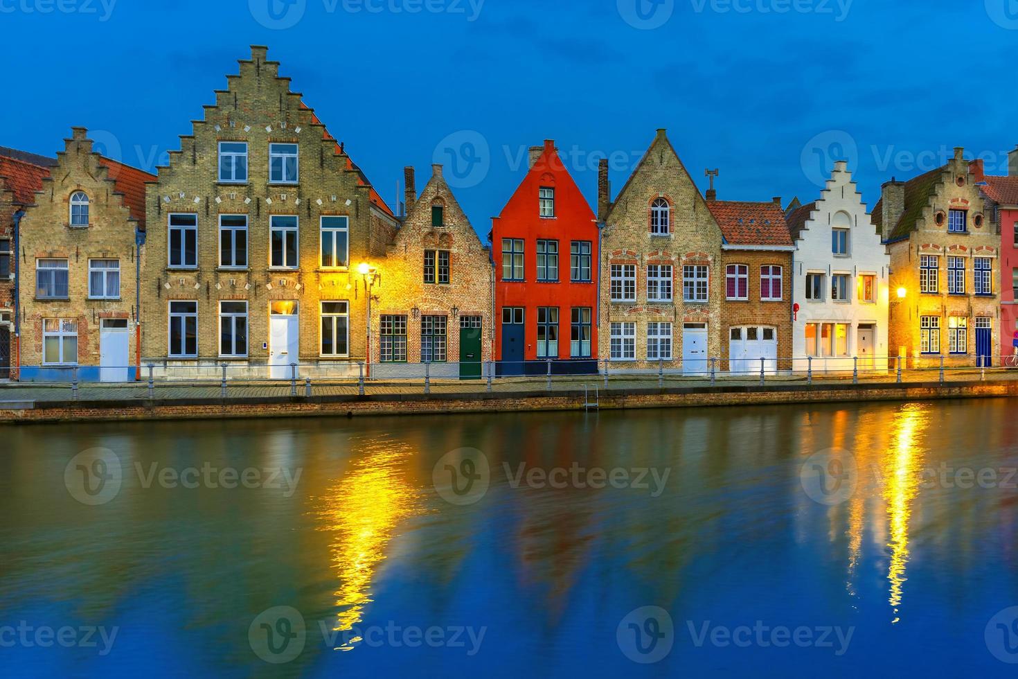 Night Bruges canal with beautiful colored houses photo