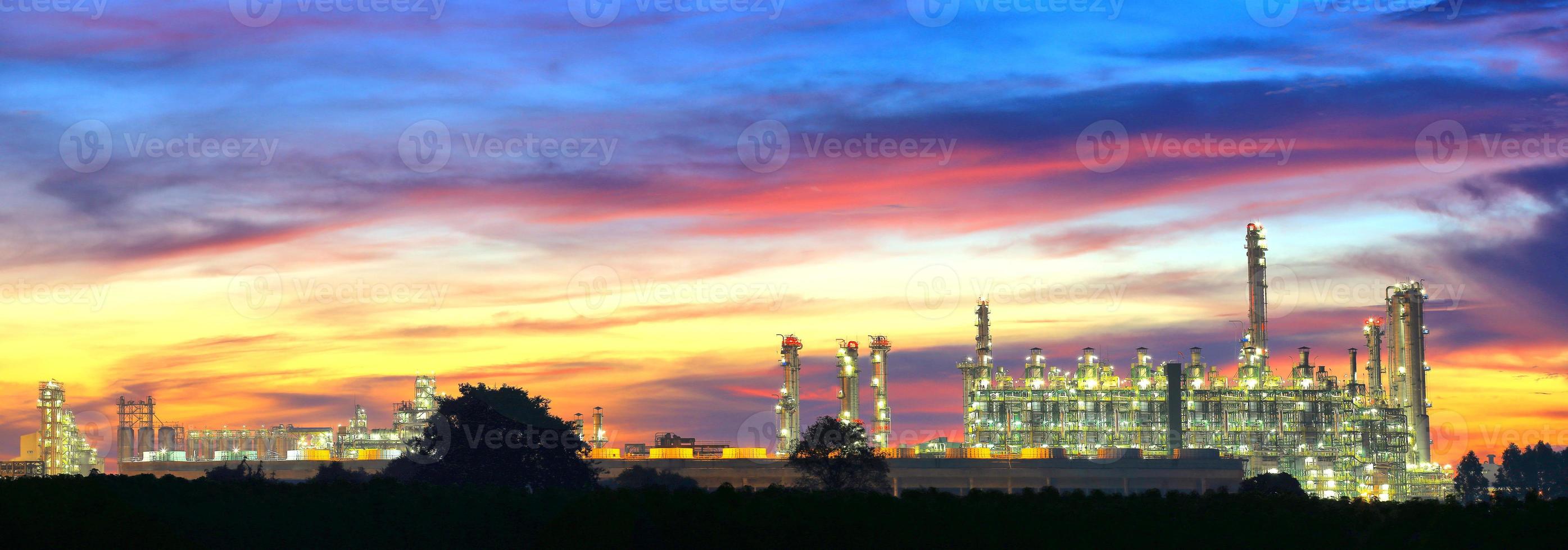 Landcsape of petrochemical oil refinery plant at night photo