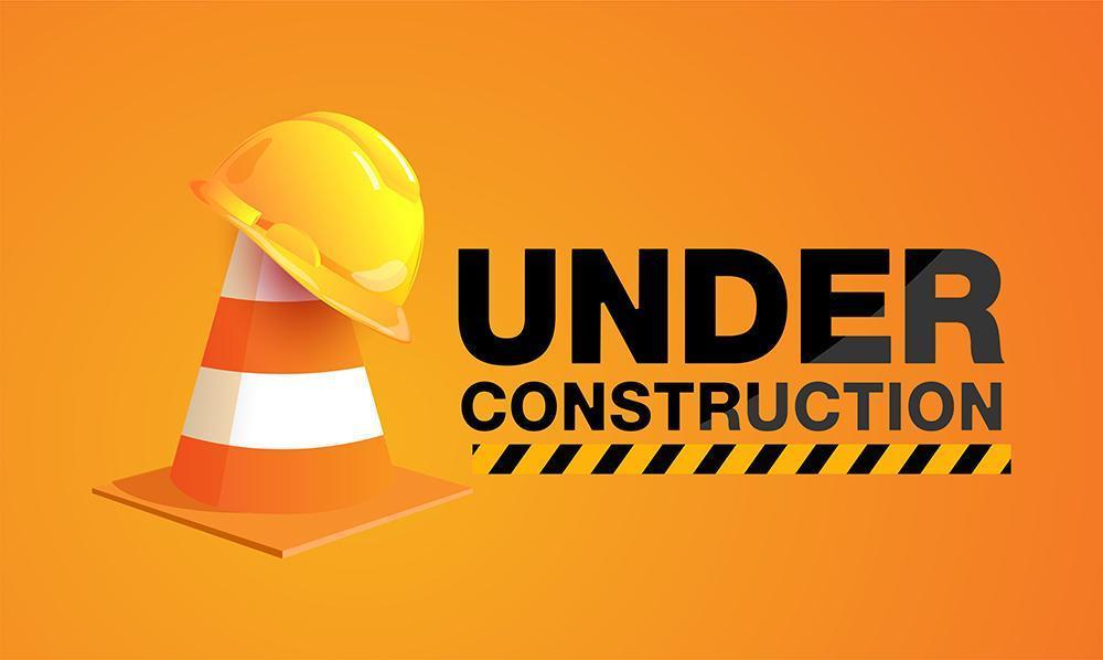 Under construction sign with hat on traffic cone vector