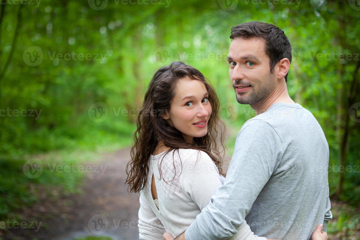 Portrait of a young happy couple in the nature photo