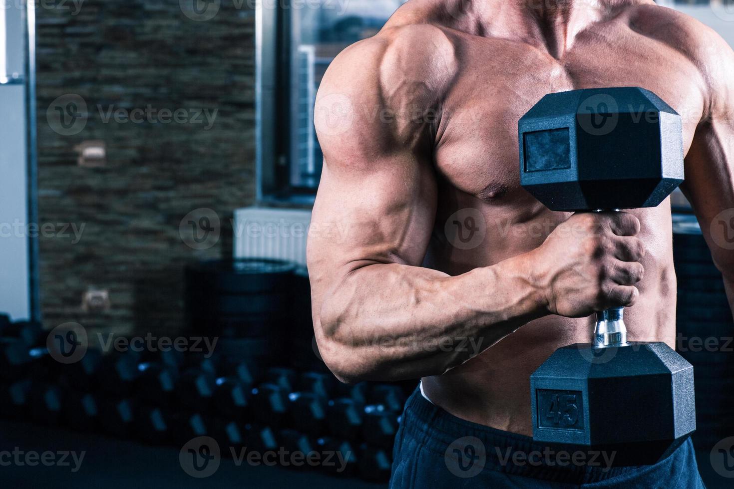 man workout with dumbbell photo