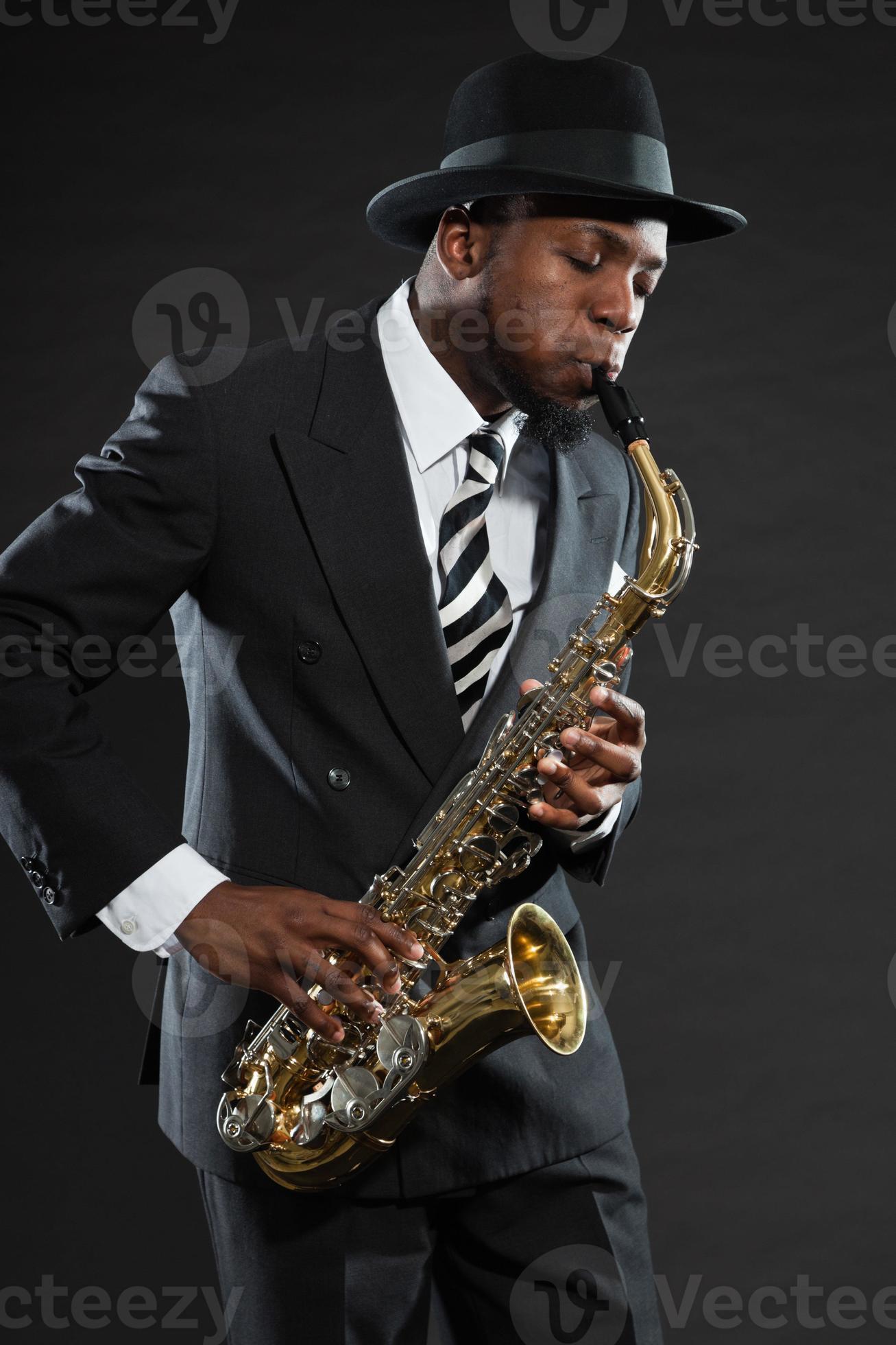 Black american jazz saxophone player. Vintage. Studio shot. 1217974