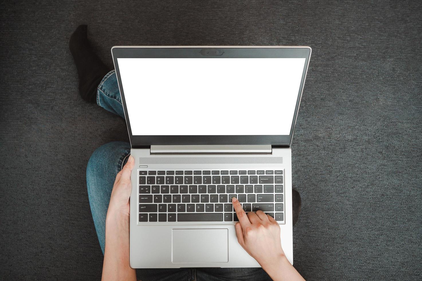 Top view of hand using blank screen laptop photo