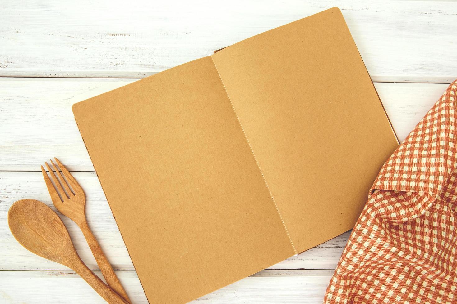Recipe book mock-up on white wooden table photo