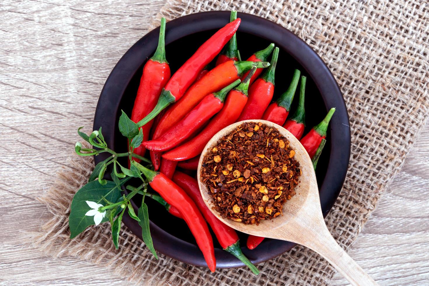 Fresh and crushed red chili peppers 1223484 Stock Photo at Vecteezy