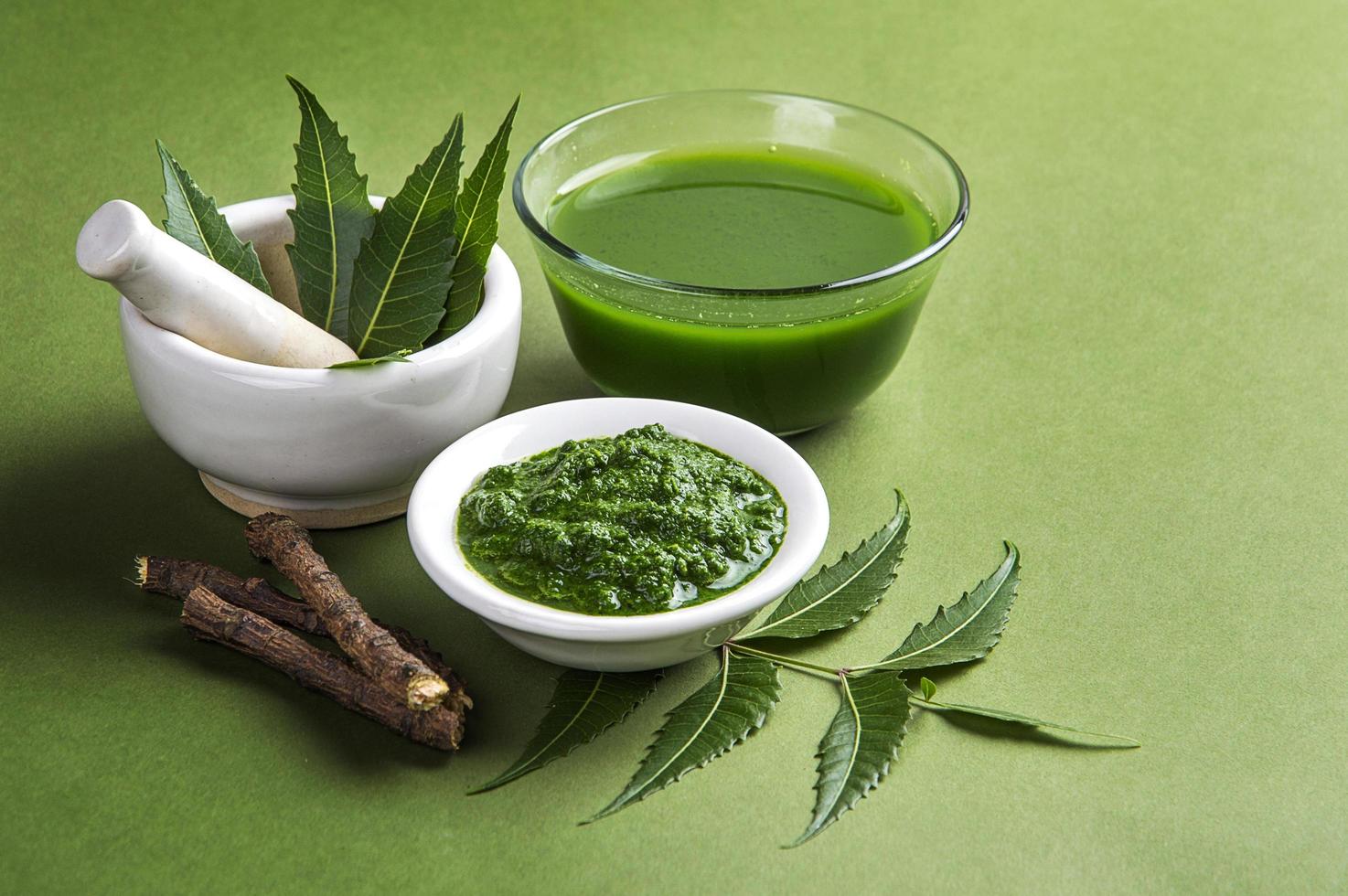 Medicinal Neem leaves in mortar and pestle  photo