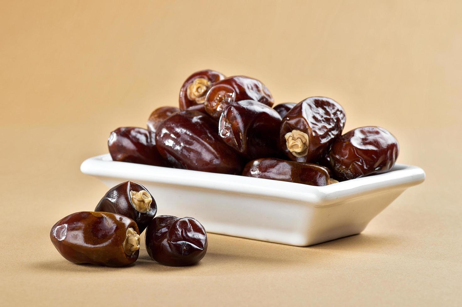 Dried dates on minimal background photo