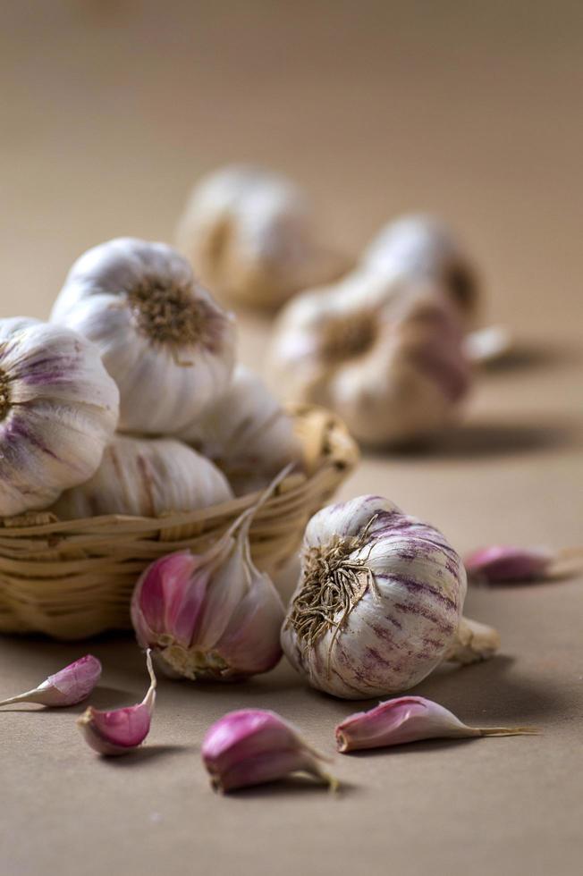 Garlic cloves and bulbs in basket photo